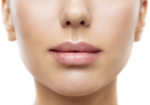 Female having a clear skin due to facial laser resurfacing treatment